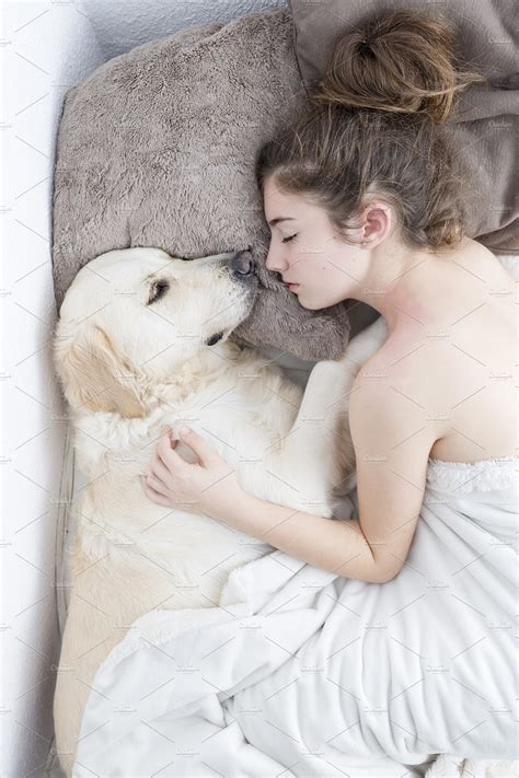 man and <b>dog</b> on bed. . Woman sleeping with dogs